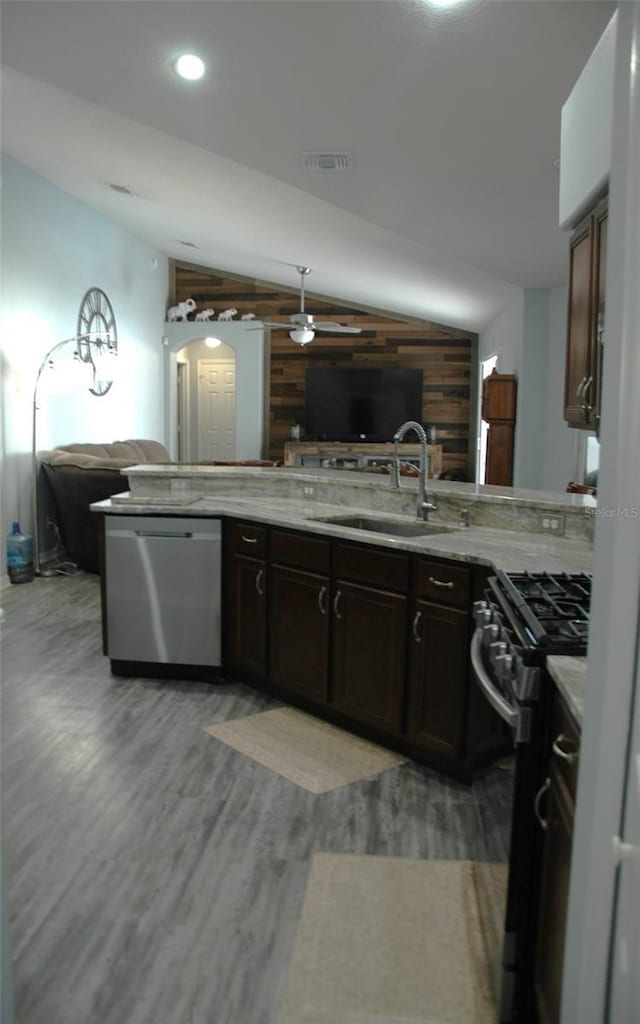 14126 Greater Pines Blvd, Clermont, FL 34711 - kitchen with stainless steel appliances, ceiling fan, open floor plan, light wood-style floors, and a sink
