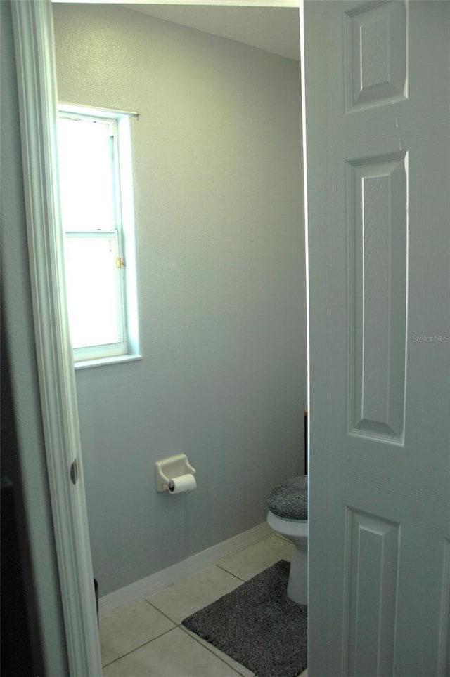 14126 Greater Pines Blvd, Clermont, FL 34711 - bathroom with toilet, tile patterned floors, and baseboards