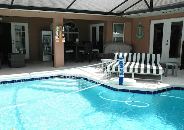 14126 Greater Pines Blvd, Clermont, FL 34711 - swimming pool with french doors, a patio area, and a lanai