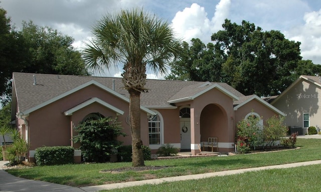 14126 Greater Pines Blvd, Clermont, FL 34711 - single story home featuring a front yard, stucco siding, and a shingled roof