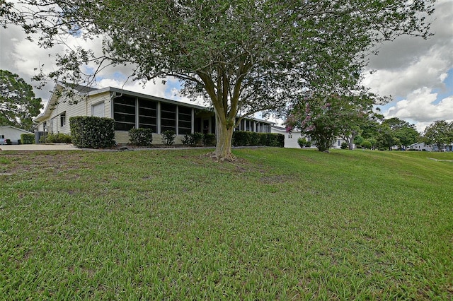 10699 SE 178th St, Summerfield, FL 34491 - view of green lawn featuring a sunroom