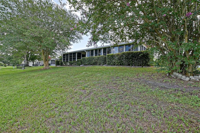10699 SE 178th St, Summerfield, FL 34491 - view of front facade featuring a front yard and a sunroom