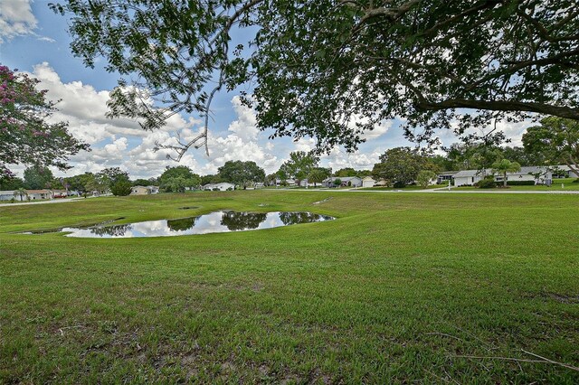 10699 SE 178th St, Summerfield, FL 34491 - view of green lawn with a water view