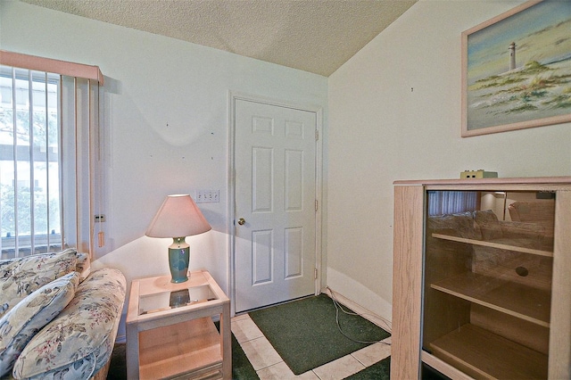 10699 SE 178th St, Summerfield, FL 34491 - tiled foyer entrance featuring healthy amount of natural light and a textured ceiling