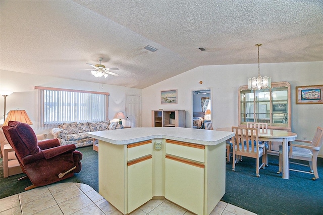 10699 SE 178th St, Summerfield, FL 34491 - kitchen with light carpet, open floor plan, light countertops, vaulted ceiling, and a ceiling fan
