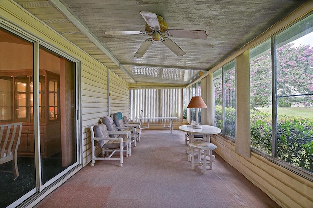 10699 SE 178th St, Summerfield, FL 34491 - sunroom / solarium featuring a ceiling fan, carpet flooring, wooden ceiling, and wooden walls