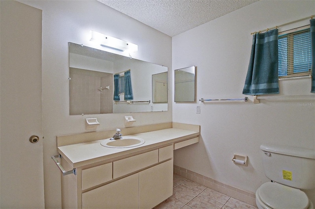 10699 SE 178th St, Summerfield, FL 34491 - bathroom featuring vanity, tile patterned floors, a textured ceiling, and a shower
