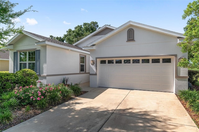 9805 SW 95th Loop, Ocala, FL 34481 - ranch-style house featuring a garage, stucco siding, and concrete driveway