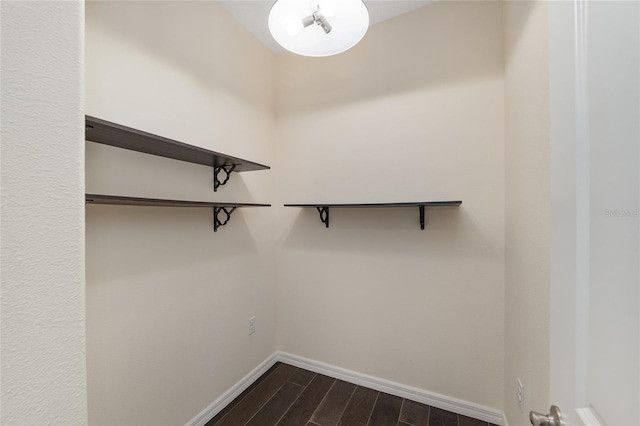 9805 SW 95th Loop, Ocala, FL 34481 - walk in closet featuring dark wood-type flooring