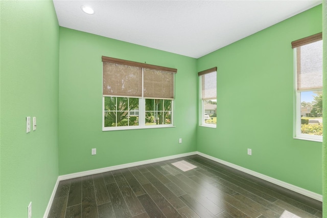9805 SW 95th Loop, Ocala, FL 34481 - spare room with dark wood finished floors, baseboards, and recessed lighting