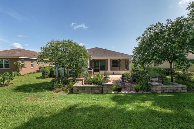 9805 SW 95th Loop, Ocala, FL 34481 - back of house featuring a lawn and stucco siding