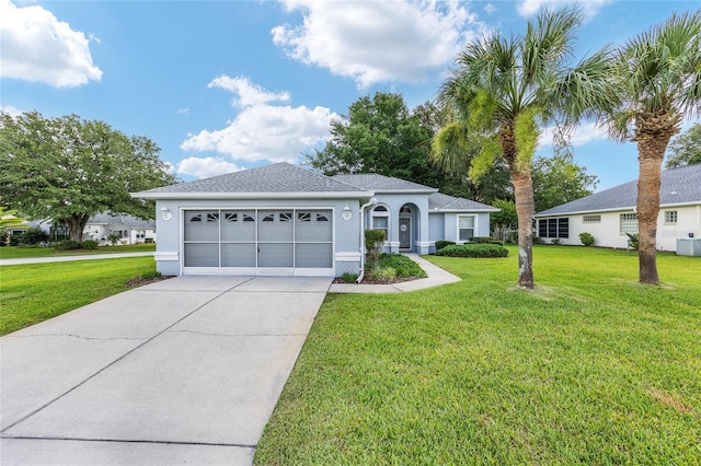 11051 SW 73rd Ct, Ocala, FL 34476 - single story home with driveway, an attached garage, a front lawn, and stucco siding