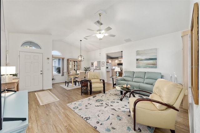 11051 SW 73rd Ct, Ocala, FL 34476 - living area featuring wood finished floors, ceiling fan, and vaulted ceiling