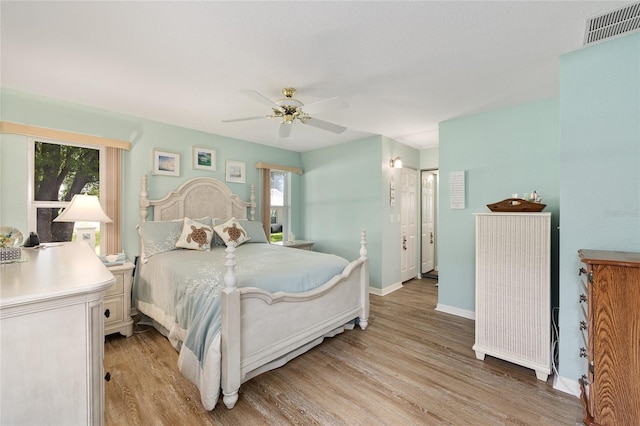 11051 SW 73rd Ct, Ocala, FL 34476 - bedroom with light wood-style flooring, baseboards, and ceiling fan