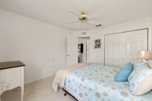 11051 SW 73rd Ct, Ocala, FL 34476 - bedroom with light carpet, ceiling fan, a closet, and baseboards