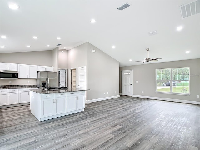 226 Locust Ln, Ocala, FL 34472 - kitchen featuring stainless steel appliances, a center island, a ceiling fan, light wood-type flooring, and white cabinets