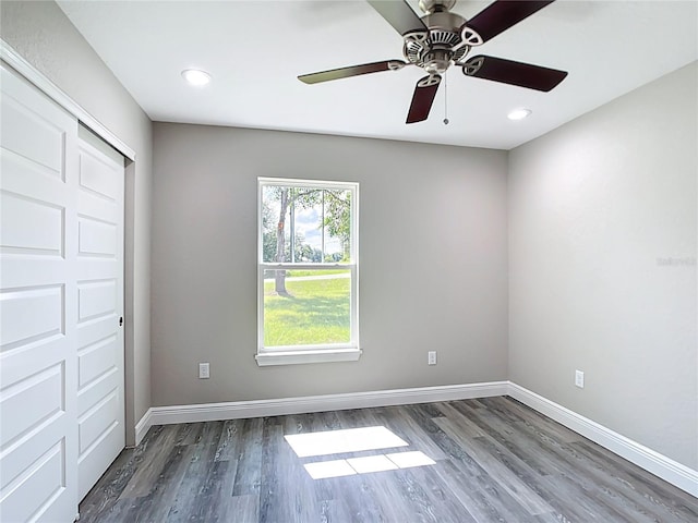 226 Locust Ln, Ocala, FL 34472 - spare room with dark wood-style flooring, a ceiling fan, and recessed lighting
