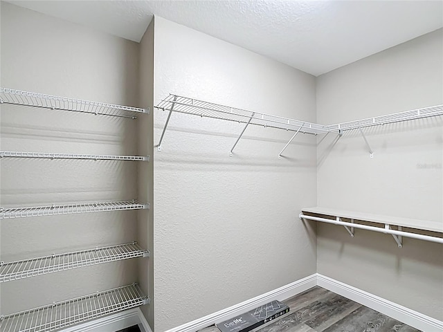 226 Locust Ln, Ocala, FL 34472 - walk in closet featuring dark wood finished floors