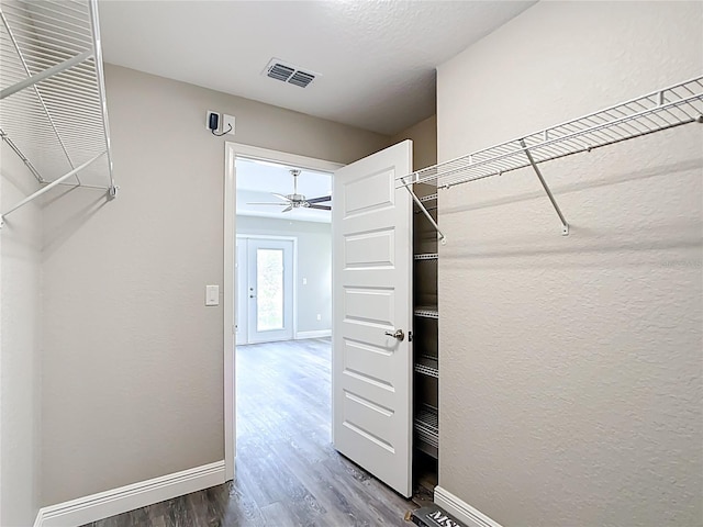 226 Locust Ln, Ocala, FL 34472 - spacious closet with dark wood-style floors and a ceiling fan