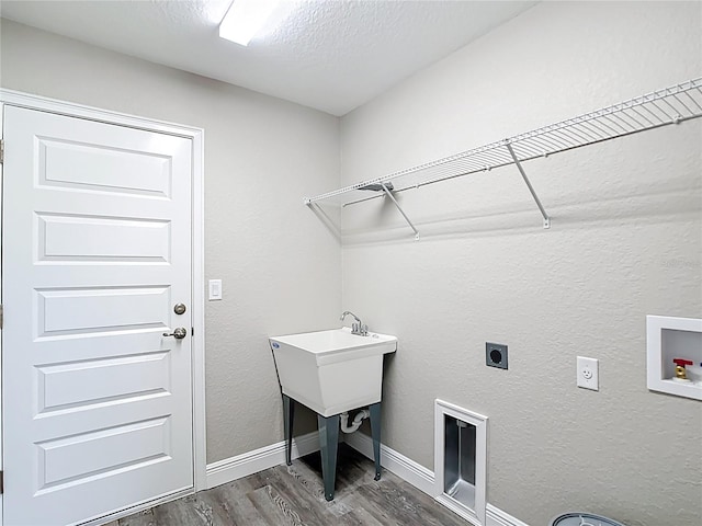 226 Locust Ln, Ocala, FL 34472 - washroom with hookup for an electric dryer, dark wood finished floors, hookup for a washing machine, and a textured ceiling