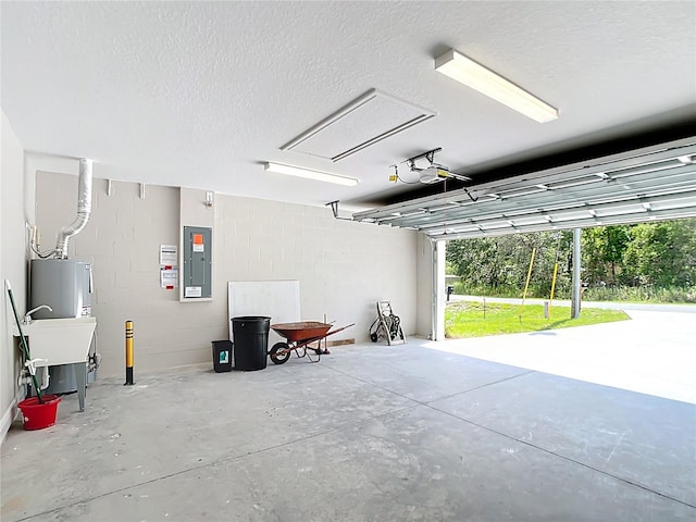 226 Locust Ln, Ocala, FL 34472 - garage with electric panel, a garage door opener, electric water heater, and concrete block wall