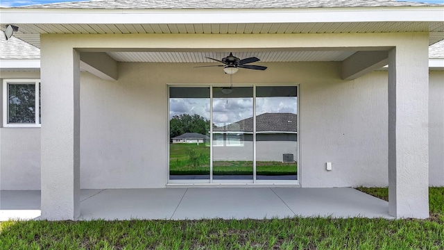 226 Locust Ln, Ocala, FL 34472 - view of side of home featuring ceiling fan, a patio area, roof with shingles, and stucco siding