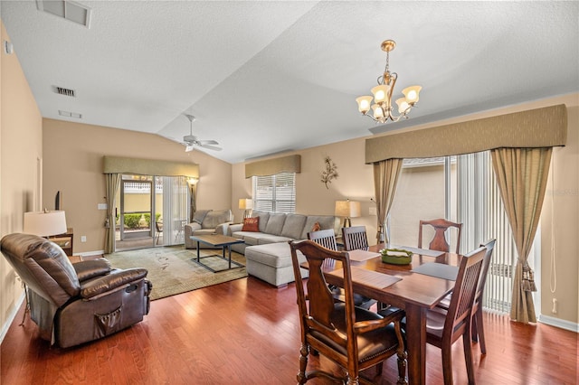 1204 Flamingo Pl, The Villages, FL 32162 - dining area with wood finished floors, a chandelier, baseboards, lofted ceiling, and a ceiling fan