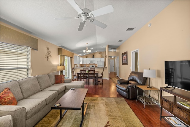 1204 Flamingo Pl, The Villages, FL 32162 - living area with a chandelier, wood finished floors, ceiling fan, lofted ceiling, and a textured ceiling