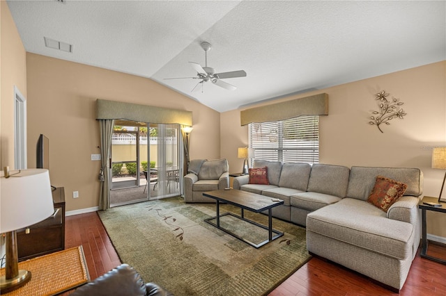 1204 Flamingo Pl, The Villages, FL 32162 - living room featuring a ceiling fan, lofted ceiling, wood finished floors, baseboards, and a textured ceiling