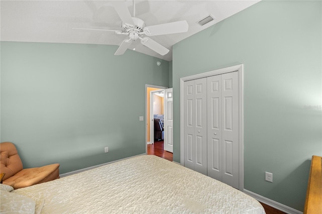 1204 Flamingo Pl, The Villages, FL 32162 - bedroom with lofted ceiling, a closet, ceiling fan, dark wood finished floors, and baseboards