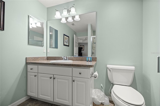 1204 Flamingo Pl, The Villages, FL 32162 - bathroom with vanity, toilet, and baseboards