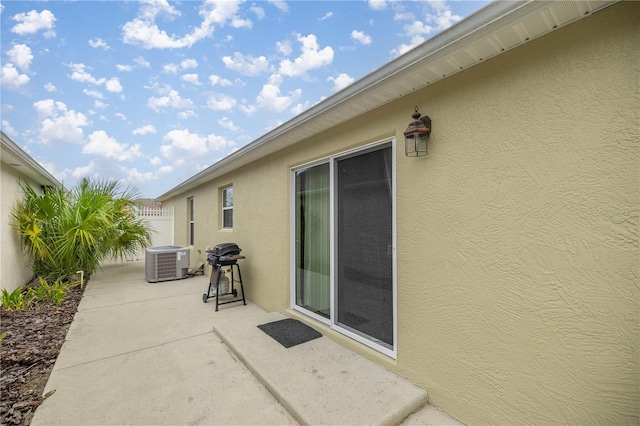 1204 Flamingo Pl, The Villages, FL 32162 - view of patio featuring central AC unit and grilling area