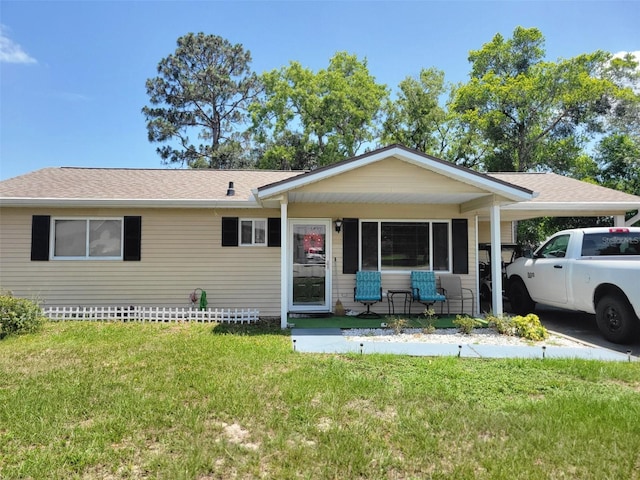 8368 SW 105th Pl, Ocala, FL 34481 - single story home with a front lawn, covered porch, and a shingled roof