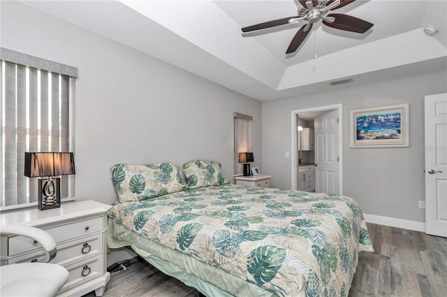 12392 SW 85th Pl, Dunnellon, FL 34432 - bedroom featuring a raised ceiling, dark wood-style flooring, and ceiling fan