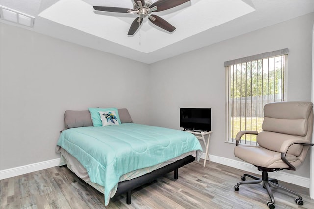 12392 SW 85th Pl, Dunnellon, FL 34432 - bedroom with light wood-style flooring, multiple windows, and ceiling fan