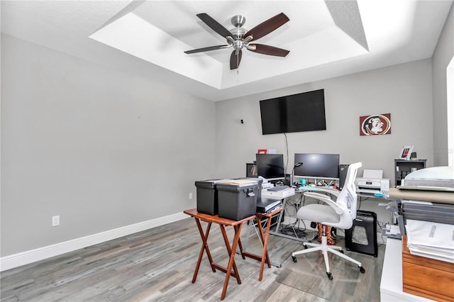 12392 SW 85th Pl, Dunnellon, FL 34432 - office with a tray ceiling, wood finished floors, and a ceiling fan
