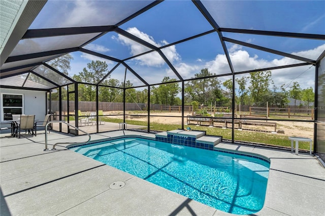 12392 SW 85th Pl, Dunnellon, FL 34432 - outdoor pool featuring a patio area, a fenced backyard, and glass enclosure