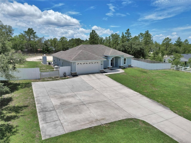 12392 SW 85th Pl, Dunnellon, FL 34432 - ranch-style home featuring a garage, concrete driveway, roof with shingles, and stucco siding