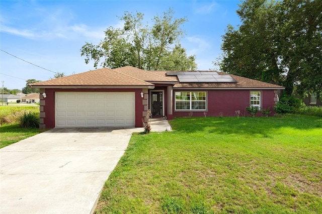 32 Dogwood Drive Loop, Ocala, FL 34472 - ranch-style home with roof mounted solar panels, a front lawn, a garage, and stucco siding