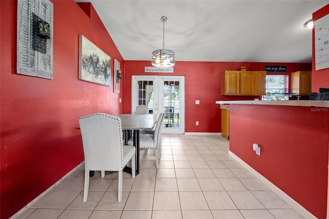 32 Dogwood Drive Loop, Ocala, FL 34472 - dining room with a chandelier, french doors, and light tile patterned flooring