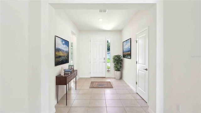 4508 SW 56th Pl, Gainesville, FL 32608 - foyer entrance featuring baseboards and light tile patterned flooring