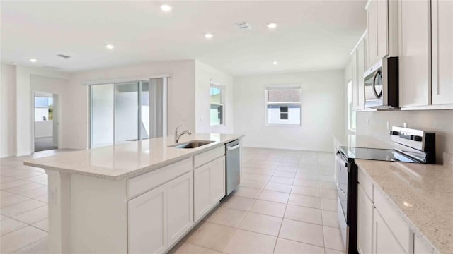 4508 SW 56th Pl, Gainesville, FL 32608 - kitchen featuring stainless steel appliances, a sink, plenty of natural light, a center island with sink, and recessed lighting