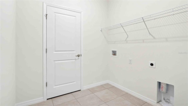 4508 SW 56th Pl, Gainesville, FL 32608 - washroom with hookup for a washing machine, hookup for an electric dryer, baseboards, and light tile patterned floors