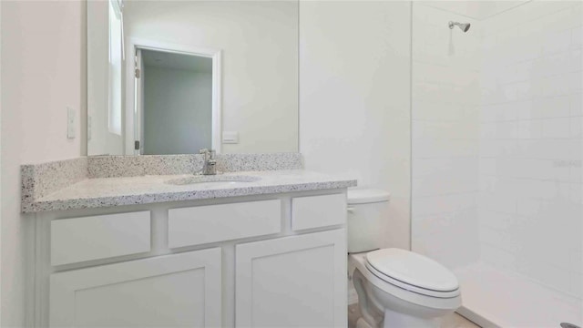4508 SW 56th Pl, Gainesville, FL 32608 - bathroom with toilet, a tile shower, and vanity