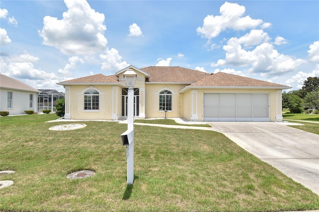 5551 NW 25th Loop, Ocala, FL 34482 - mediterranean / spanish house with driveway, a garage, a front lawn, and stucco siding