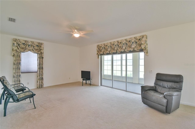5551 NW 25th Loop, Ocala, FL 34482 - living area with ceiling fan and light carpet