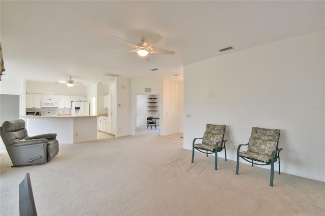 5551 NW 25th Loop, Ocala, FL 34482 - sitting room with a ceiling fan and light carpet