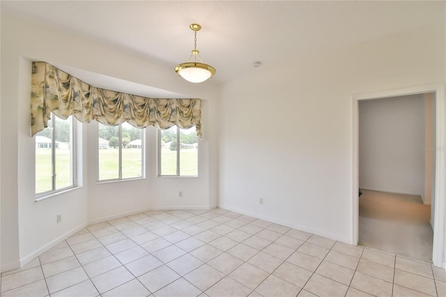 5551 NW 25th Loop, Ocala, FL 34482 - spare room featuring light tile patterned flooring and baseboards