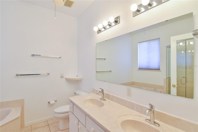 5551 NW 25th Loop, Ocala, FL 34482 - bathroom with tile patterned floors, double vanity, a bath, and a stall shower