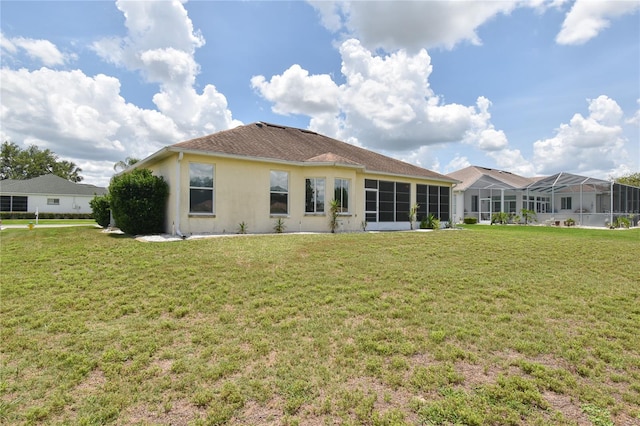 5551 NW 25th Loop, Ocala, FL 34482 - rear view of property with a yard and stucco siding